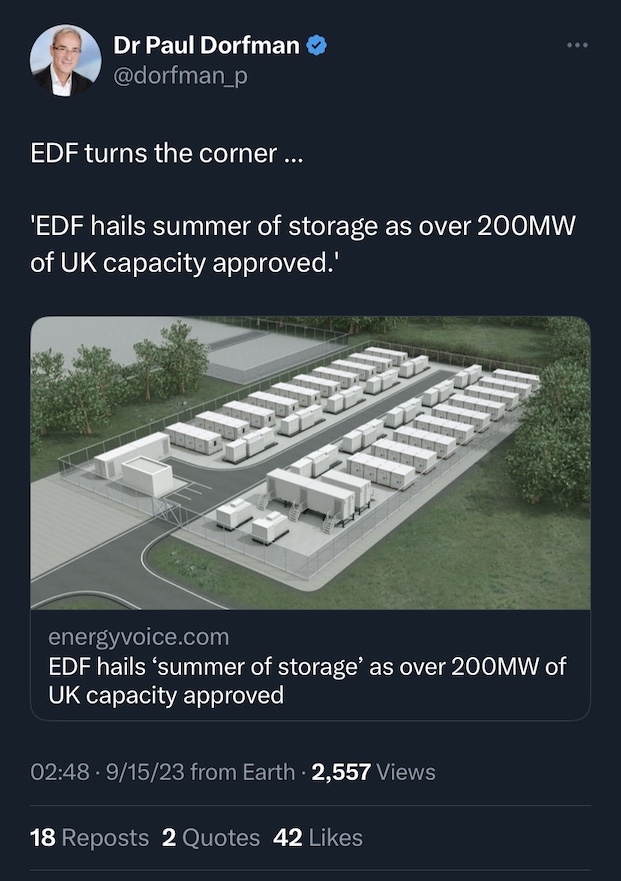 A screenshot of a Tweet with a picture of a model of an outdoor industrial system with several dozen large white containers behind a fence, along with text stating that the storage capacity is 200 Megawatts