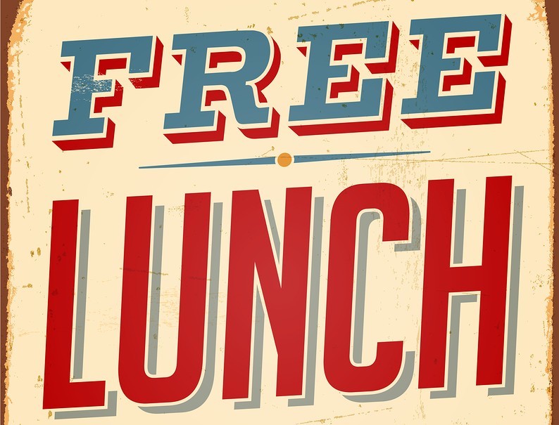 A sign that says 'free lunch' in block, capital letters