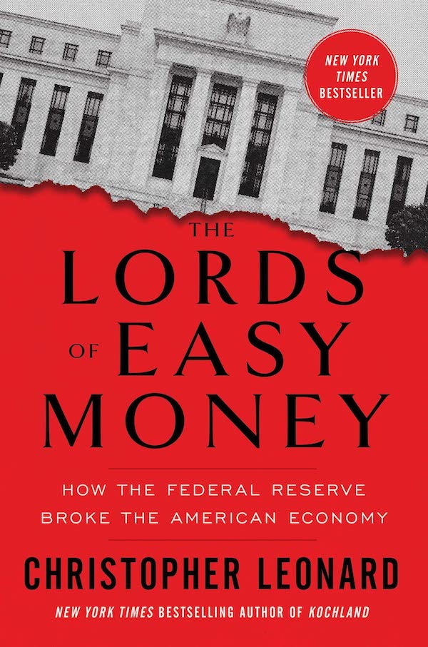 The cover of the book 'The Lords of Easy Money', featuring a tilted, torm picture of the headquarters building of the Federal Reserve above a blood red background