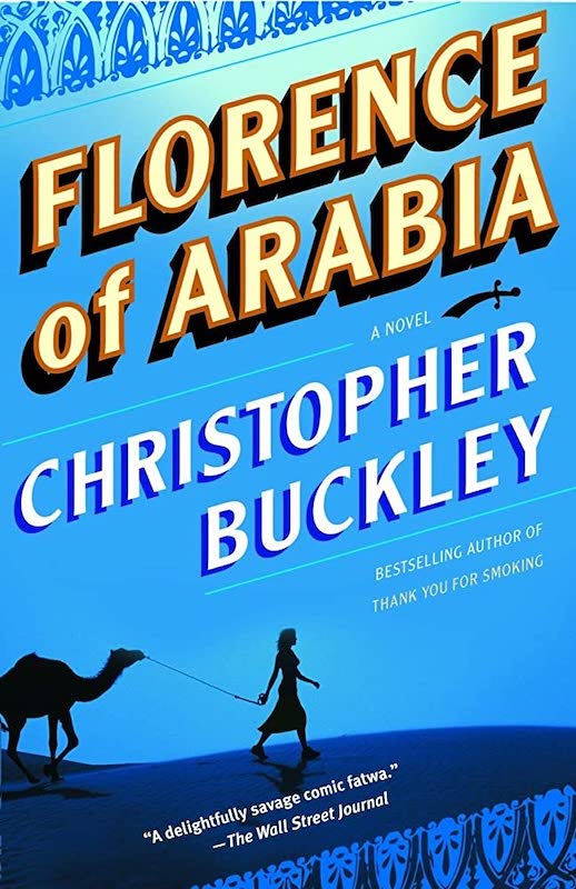 A book cover with a blue background with some ornate geometric patterns at the upper and lower edges, with the title and author's name in large lettering sloping upwards, and a black silhouette of a woman leading a camel on a leash across a blue sand dune