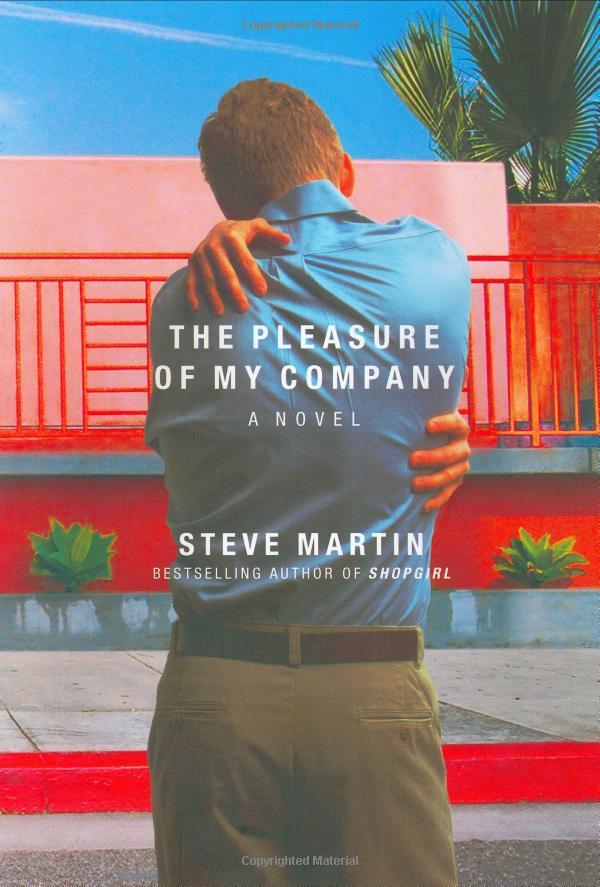 A book cover, with the title and author's name, featuring the image of the back of a man dressed in slacks and a collared shirt, standing on the street in front of a pink and red house, with hands gripping the man's shoulder and side, those hands probably belonging to the man himself as there is no other evidence of anyone else