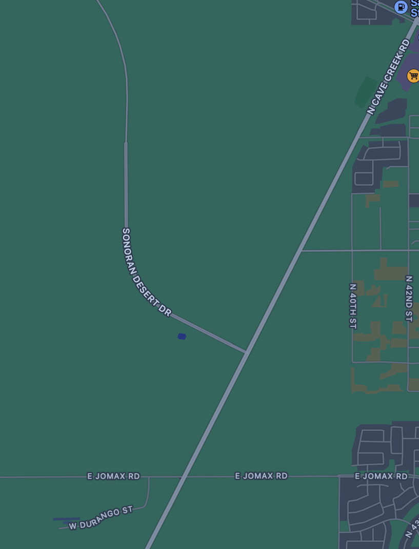 A computer map display with a green background and a few roads displayed, one of which is a curvy road that intersects with a completely straight road